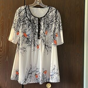 No Brand short sleeved white top with birds. Size Large.
